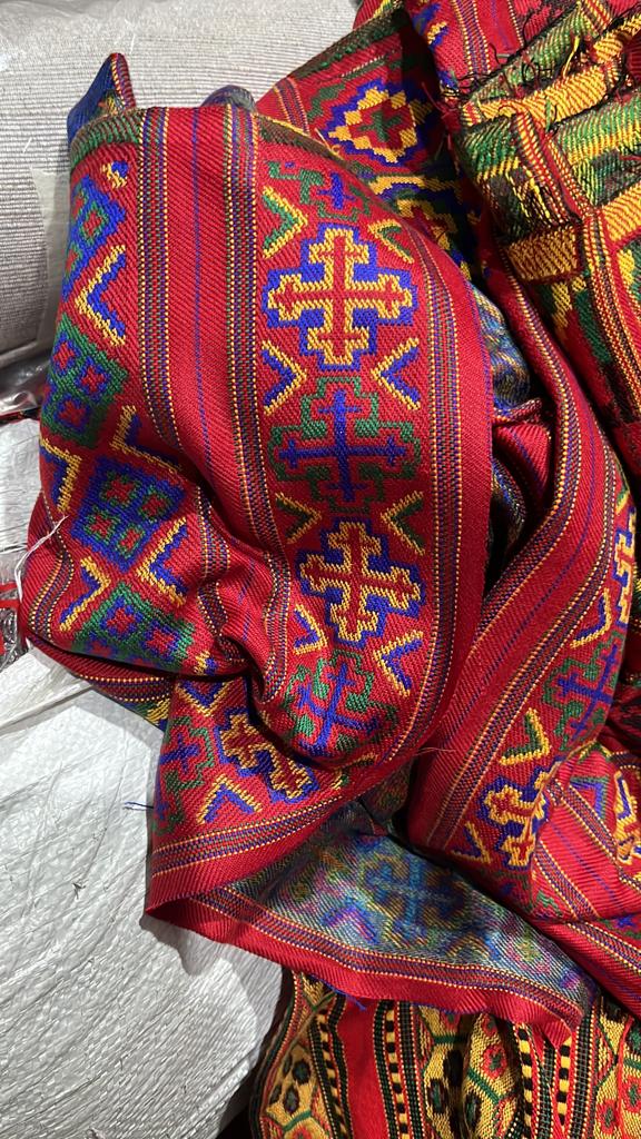 The KULLU Patti (LACE) Border by aruna kullu handloom features vibrant red as the base, with blue, yellow, green, and orange geometric and cross patterns in a traditional design—perfect for enhancing suits, kurtis, and dress material (3 M).