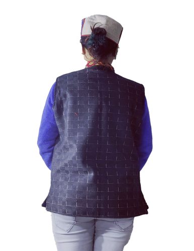 Black woolen reversible ladies jacket with traditional woven patti trim.