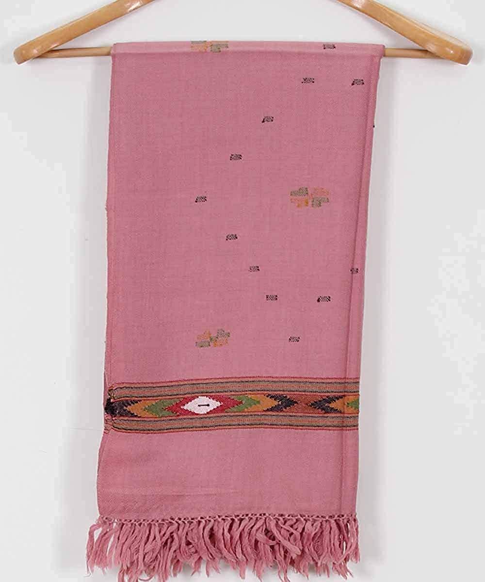 The ARUNA Women's Wool Shawl from aruna kullu handloom features a Kinnauri woven multicolour border, elegant pink wool fabric, and fringed tassels—ideal for those seeking authentic Manali shawls.