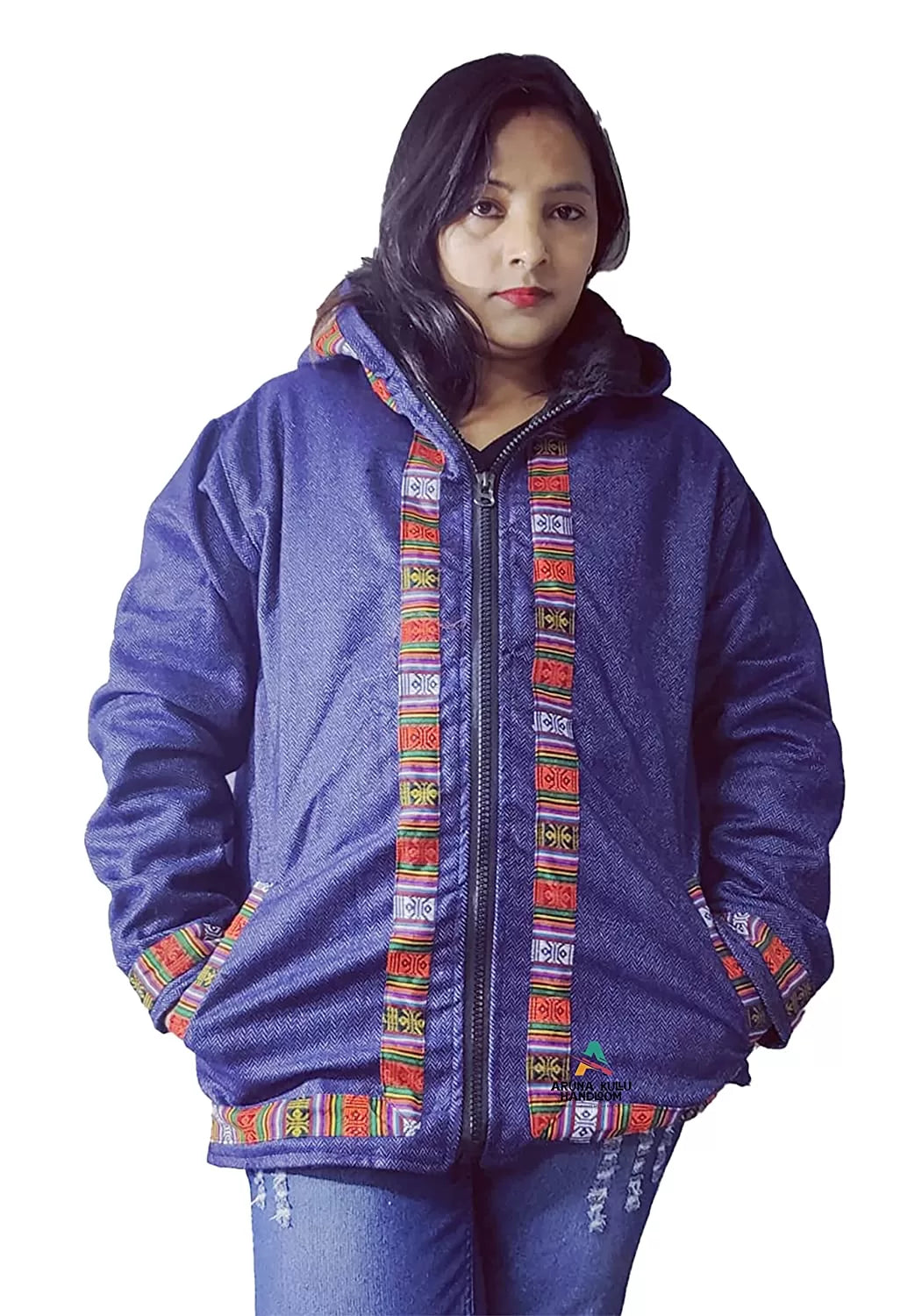 A woman wearing the aruna kullu handloom Woolen Winter Wear ZIPPER HOODIE Jacket for Men & Women in machikanda blue, featuring Kullu Patti work on the zipper, pockets, and cuffs, stands against a white background with a neutral expression.