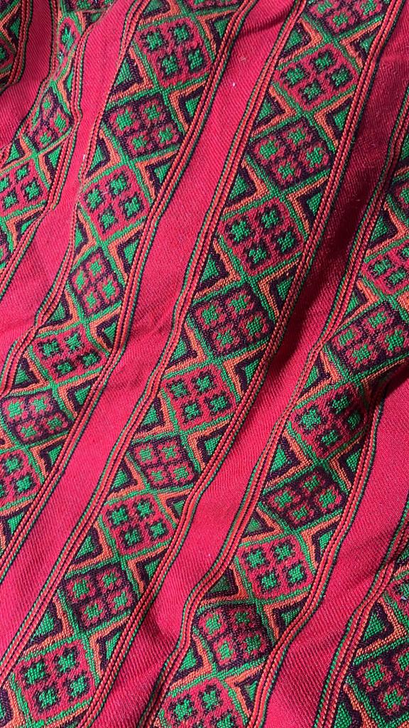 The aruna kullu handloom KULLU Patti (LACE) Border for Suits, Kurtis, and Other Dress Material (3 M) features a textured woolen handloom fabric with vibrant red, green, and black geometric diamond and square patterns in horizontal rows.