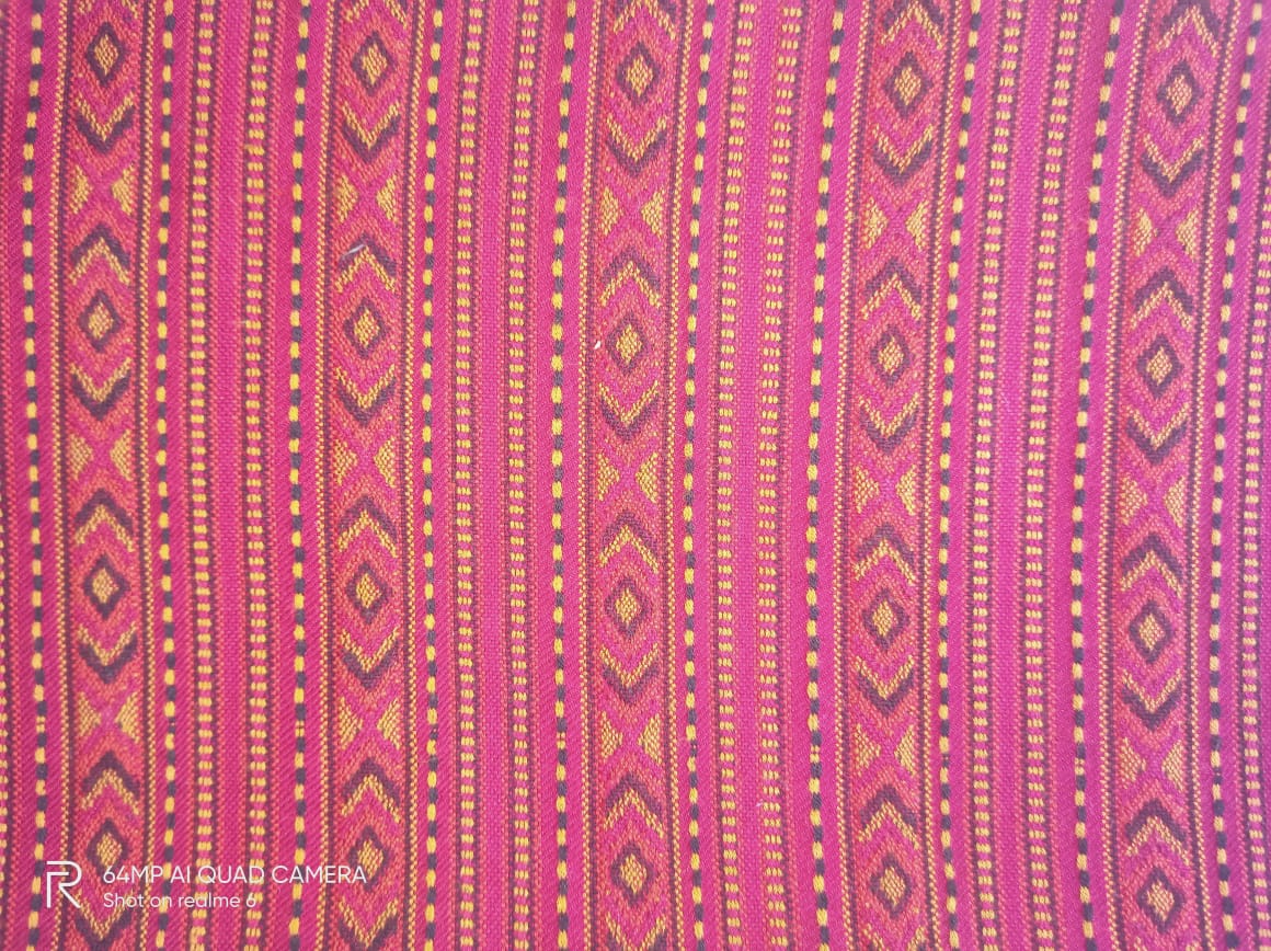 A close-up of the Hand Woven PASHMINA MAROON Shawl by aruna kullu handloom, featuring colorful geometric patterns with diamonds and vertical stripes, showcasing traditional artistry and vibrant embroidery for women.