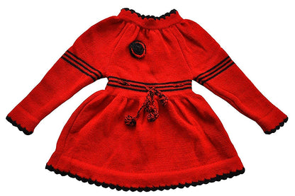 The ARUNA HANDLOOM PURE WOOL HAND KNITTED Woolen Frock (Red) by aruna kullu handloom is a long-sleeved, red frock for kids with black trim, black stripes on chest and waist, and decorative black knitted flowers.