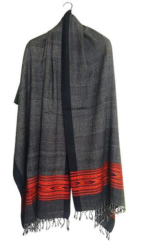 himachali shawl himachali shawl online himachali shawl design himachali shawl price himachali shawl for women The ARUNA Premium Pure Wool Kullu Shawl from aruna kullu handloom is a dark gray unisex woolen shawl with black borders, red and orange geometric motifs near the fringed ends, inspired by traditional Kullu designs.