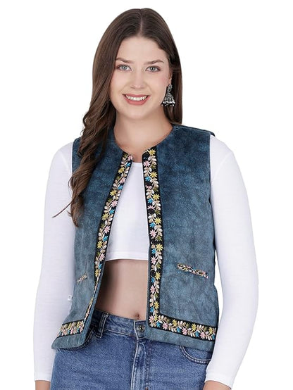 Himachali Sadri Himachali Half Jacket for ladies sadri jacket for women kullu jacket for ladies Sadri for women himachali sadri for ladies A woman smiles at the camera wearing an aruna kullu handloom Nehru jacket for women with embroidery work in blue over a white long-sleeve crop top and blue jeans.