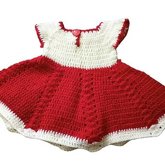 The aruna kullu handloom woolen baby FROCK (0-12 months) features a handmade white top, red skirt, red neckline button, and white trim—ideal for those seeking unique crocheted woolen clothes for babies.