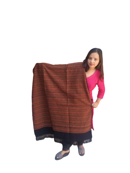 A woman in pink holds up an aruna kullu handloom Hand Woven PASHMINA black Shawl, beautifully hand woven and embroidered for women, against a plain white background.