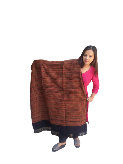 A woman in pink holds up an aruna kullu handloom Hand Woven PASHMINA black Shawl, beautifully hand woven and embroidered for women, against a plain white background.