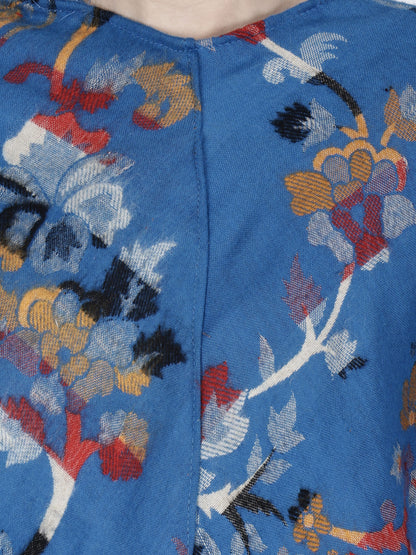 Close-up of the blue Kashmiri poncho woolen poncho with hood for ladies by aruna kullu handloom, featuring colorful floral patterns and a vertical seam—ideal for showcasing fine embroidery details.