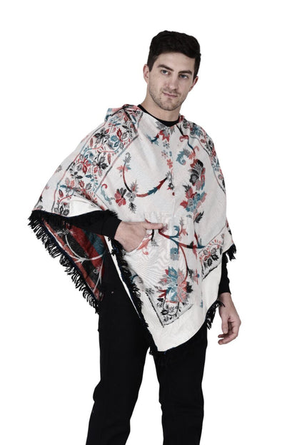 A man with short dark hair models the aruna kullu handloom Shimla jacket price kullu shawl woolen poncho with hood kashmiri silver over a black outfit, standing against a white background.Pahadi poncho for men pahadi kullu poncho mens kullu woolen poncho himachali poncho for men Himachali poncho online