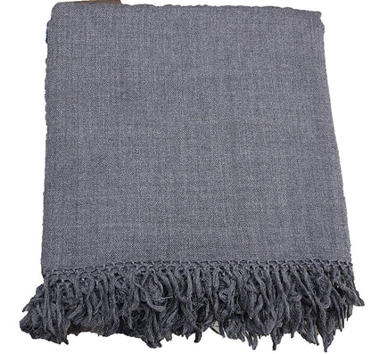 The ARUNA Genuine Hand Woven Kullu Wool LOI by aruna kullu handloom is a dark grey shawl for men, crafted from pure wool with decorative tassels along the bottom edge, shown folded on a plain white background.
