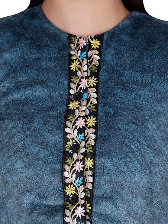 Close-up of a woman's upper torso wearing the "Nehru jacket women with embroidery work blue" by Aruna Kullu Handloom, paired over a textured blue kurta. The jacket features floral embroidery in yellow, pink, and white with black buttons.