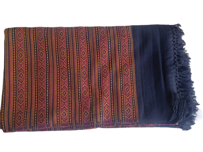 The "Hand Woven PASHMINA Black Shawl" by aruna kullu handloom is a pure woolen, hand-woven shawl for women, featuring colorful geometric embroidery on black, solid sections, and fringed edges shown on a white background.