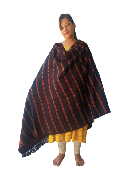 A woman stands barefoot against a white background, wearing a yellow dress, cream leggings, and the aruna kullu handloom Hand Woven PASHMINA BLACK Shawl Beautiful Hand Woven Embroidered for Women, draped over her shoulders.