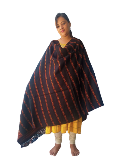 A woman stands barefoot against a white background, wearing a yellow dress, cream leggings, and the aruna kullu handloom Hand Woven PASHMINA BLACK Shawl Beautiful Hand Woven Embroidered for Women, draped over her shoulders.