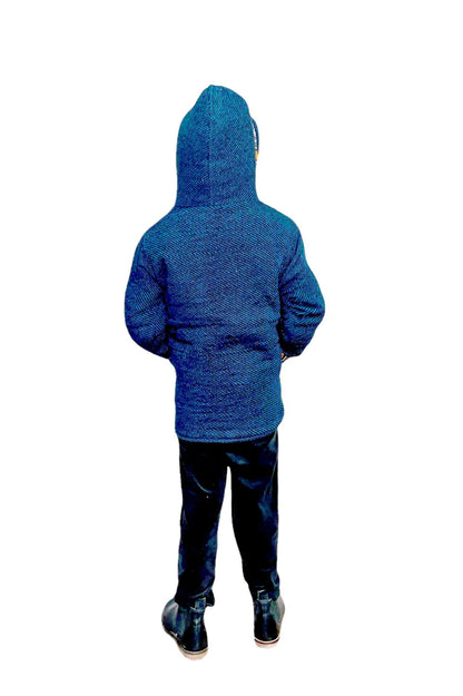 A child in the aruna kullu handloom Woolen Winter Wear ZIPPER HOODIE FOR KIDS, paired with dark pants and black shoes, stands facing away against a pure white background.