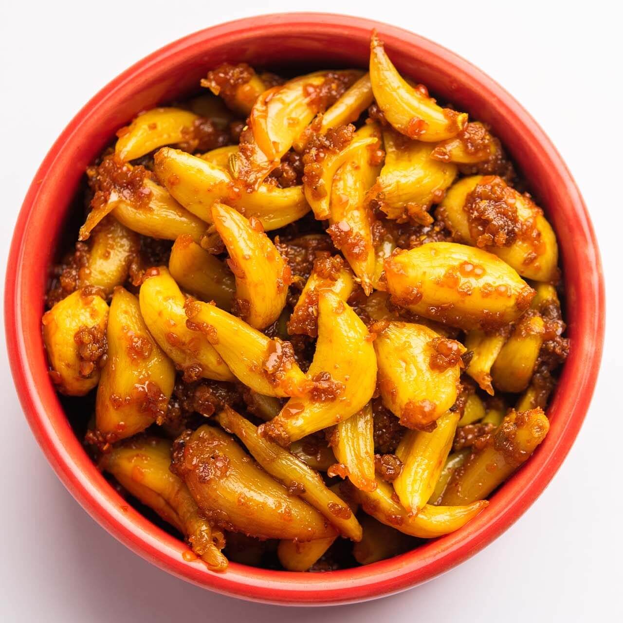 Jar of homemade organic garlic pickle, lehsun ka achar.