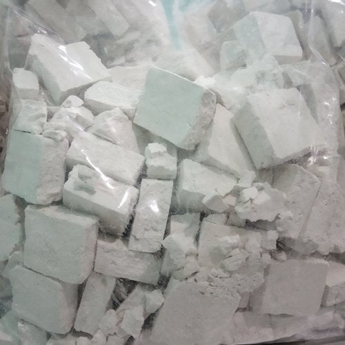 A clear plastic bag with white, chalky blocks and powder holds authentic Himachali Sheera 500GM by Aruna Kullu Handloom—ideal for those craving genuine Himachali flavors.