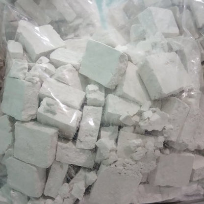 A clear plastic bag with white, chalky blocks and powder holds authentic Himachali Sheera 500GM by Aruna Kullu Handloom—ideal for those craving genuine Himachali flavors.